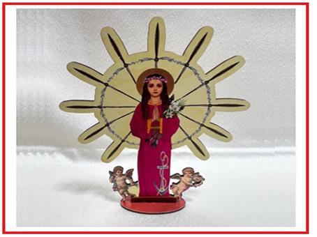 Wooden statue of St. Philomena with prayer