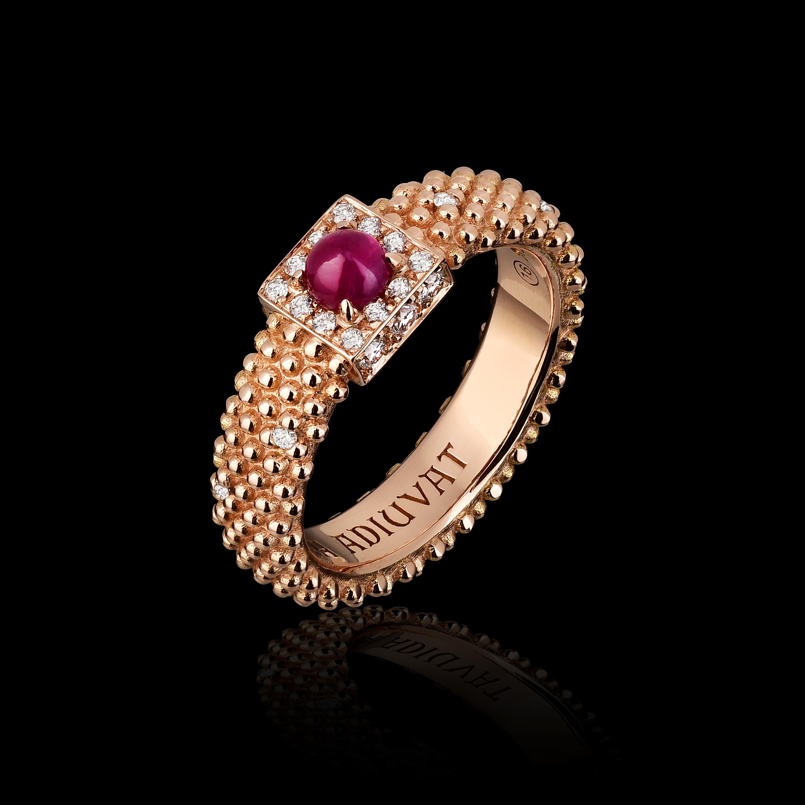 18kt rose gold, ruby ​​center stone with 18 natural white diamonds framing and diamond points