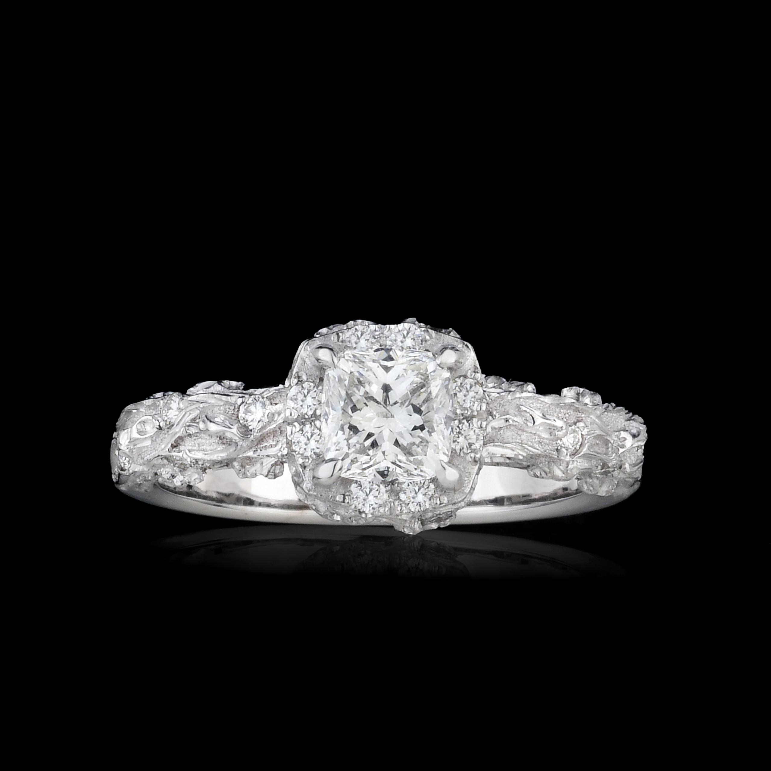 18kt white gold, natural white diamond center stone with 8 diamonds framing and 6 on the band